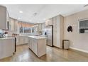 Modern kitchen with gray cabinets, stainless steel appliances, and a marble-topped island at 3640 York St, Denver, CO 80205