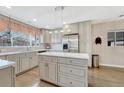 Modern kitchen with gray cabinets, stainless steel appliances, and a marble-topped island at 3640 York St, Denver, CO 80205