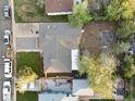 An aerial view of the property showcasing the layout, yard with fire pit, and neighborhood at 1085 Victor St, Aurora, CO 80011