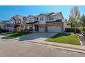Charming two-story home featuring a well-kept lawn and three-car garage, ideal for families at 15122 Fillmore Way, Thornton, CO 80602
