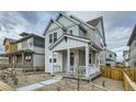 Two-story home with inviting covered porch and well-kept gravel landscaping at 2751 E 102Nd Pl, Thornton, CO 80229