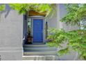 Charming home entrance with a bright blue front door, sidelights, and a welcoming staircase at 787 Eldorado Dr, Superior, CO 80027
