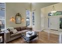 Bright living room features hardwood floors, high ceilings, and large windows for natural light at 787 Eldorado Dr, Superior, CO 80027