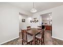 Cozy dining area with warm lighting and seating for four at 481 Vista Blvd, Brighton, CO 80603