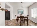 Inviting dining room featuring a wooden table and chairs, perfect for Gathering meals at 481 Vista Blvd, Brighton, CO 80603