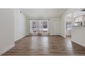 Bright living room with hardwood floors and large windows at 1901 Clinton St, Aurora, CO 80010