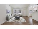 Living room with hardwood floors and stylish furniture at 1901 Clinton St, Aurora, CO 80010