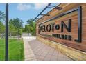 Close up of the Peloton Boulder building sign with greenery in the background at 3701 Arapahoe Ave # 106, Boulder, CO 80303