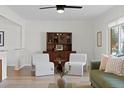 Bright living room features hardwood floors, modern decor, and large windows at 10801 W 29Th Ave, Lakewood, CO 80215
