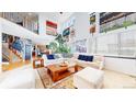 Sun-filled living room features high ceilings, large windows, and an open layout at 6051 E 160Th Pl, Brighton, CO 80602