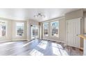 Inviting living room featuring large windows, elegant flooring, and outdoor access to the patio at 2503 N Ogden St, Denver, CO 80205