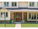 Welcoming front entrance featuring beautiful double doors and brick accents at 4810 W 102Nd Pl, Westminster, CO 80031
