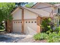 Spacious three-car garage with well-maintained doors and landscaping at 4810 W 102Nd Pl, Westminster, CO 80031