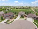 An elevated view showcases the home's position within a well-planned community with green spaces at 1523 Honeysuckle Ct, Brighton, CO 80601