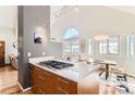 Open kitchen with granite countertops, stainless appliances, and a view to the dining area at 4861 Curie Ct, Boulder, CO 80301