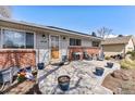 Inviting front porch featuring a seating area, decorative plants, and a beautiful wooden front door at 6719 W 70Th Ave, Arvada, CO 80003
