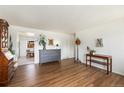 Spacious living room featuring hardwood floors and ample space for furniture and decor at 6719 W 70Th Ave, Arvada, CO 80003