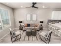 Bright living room with modern furnishings and hardwood floors at 157 Ambrose St, Erie, CO 80516