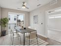 This lovely dining room features a modern light fixture, a stylish rug, and plenty of natural light at 3500 S Corona St # 409, Englewood, CO 80113