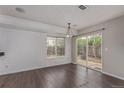 Open dining area with hardwood floors and a sliding door to the backyard at 4152 Netherland St, Denver, CO 80249