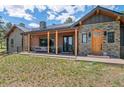 Relaxing front porch with comfortable seating and stylish wood pillars at 25350 Ridge Way, Golden, CO 80401