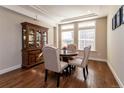 Elegant dining room with hardwood floors, stylish furniture, and ample natural light; perfect for entertaining at 1665 Avery Way, Castle Rock, CO 80109