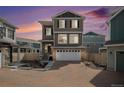Attractive exterior of a multi-story home showcasing a two-car garage, stone accents, and well-maintained landscaping at 4108 N Quatar Ct, Aurora, CO 80019