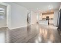 Spacious open-concept living area featuring modern finishes and hardwood flooring throughout at 4773 Kittredge St, Denver, CO 80239