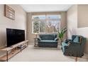 Inviting living room featuring comfortable seating and a view to the outside at 6001 S Yosemite St # F207, Greenwood Village, CO 80111