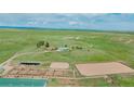 Panoramic aerial view of sprawling horse property including home and riding facilities at 27115 County Road 13, Elizabeth, CO 80107