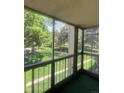 Enjoy the beautiful outdoor view from this lovely screened-in porch at 13626 E Bates Ave # 207, Aurora, CO 80014