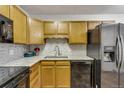 An inviting kitchen featuring stylish countertops and modern appliances at 13626 E Bates Ave # 207, Aurora, CO 80014