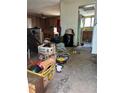 Interior shot of the living room filled with an abundance of clutter and old furniture at 3150 W 134Th Ave, Broomfield, CO 80020