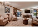 Cozy living room with wood accents, fireplace, and mounted guitars at 9658 Coronado Ct, Parker, CO 80134
