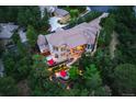 Aerial view of property showcasing mature trees, manicured landscaping and serene backyard at 254 Lead Queen Dr, Castle Rock, CO 80108