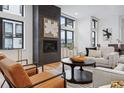 Elegant living room with a fireplace and comfortable seating at 838 Ash St # 1, Denver, CO 80220