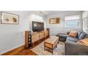 Cozy living room featuring a modern entertainment center and comfortable seating area at 4374 S Washington St, Englewood, CO 80113
