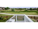 View of a backyard with grass and a walking trail at 10387 Harrisburg St, Parker, CO 80134