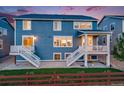 Backyard with stairs to a deck and patio featuring access to the interior of the home at 10387 Harrisburg St, Parker, CO 80134