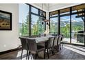 Modern dining room with mountain views and a large table at 52 West Point Lode # A, Breckenridge, CO 80424