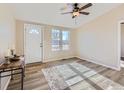 Spacious living room with light walls and wood-look floors at 3338 S Canosa Ct, Englewood, CO 80110