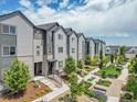 Well-maintained townhome community with mature landscaping and walkways at 5387 Pierson Ct, Wheat Ridge, CO 80033