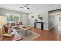 Bright living room features modern decor, wood floors, and a ceiling fan for comfortable living at 2751 S Elm St, Denver, CO 80222