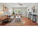 This living room features modern decor, wood floors, and a large window for natural light at 2751 S Elm St, Denver, CO 80222