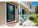 Inviting front porch with seating area and well-manicured landscaping, a perfect spot to relax at 64 N Harlan St, Lakewood, CO 80226