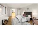 Spacious bedroom with plush bedding and en-suite bathroom access at 1551 N Larimer St # 2504, Denver, CO 80202