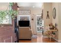 Living room featuring a cozy atmosphere with a fireplace and mountain view at 110 Oakdale Dr, Palmer Lake, CO 80133