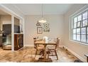 Cozy dining area featuring a wooden table set for four, bathed in natural light at 963 N Logan St # 11, Denver, CO 80203