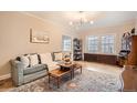 Bright living room featuring a comfortable couch, stylish lighting, and charming decor at 963 N Logan St # 11, Denver, CO 80203