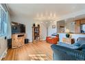 Bright living room with hardwood floors and open floor plan at 12235 E Kentucky Ave, Aurora, CO 80012